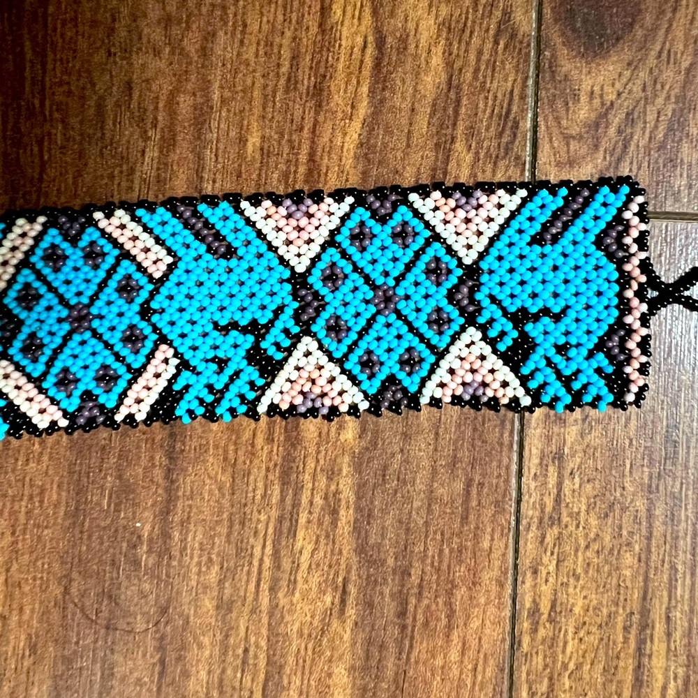 Beaded style white blue, and move and black bracelet.